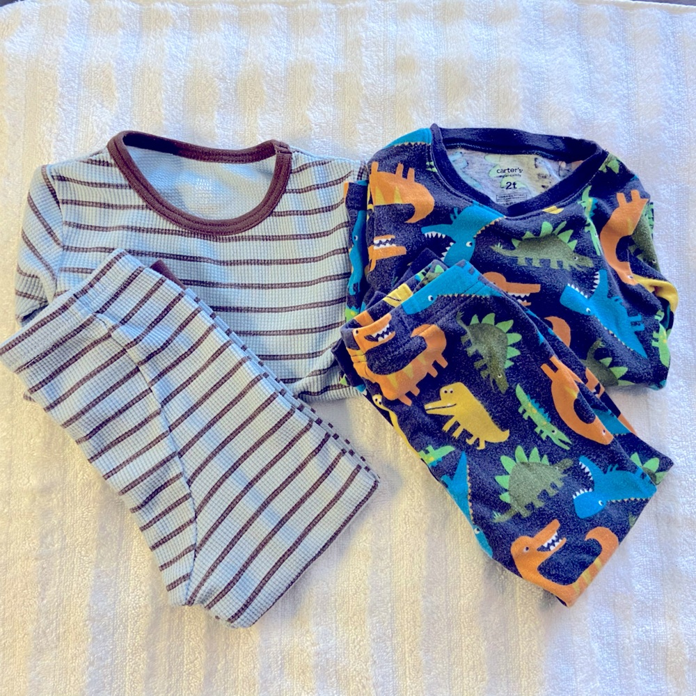 2 sets of Carters size 2T pajamas